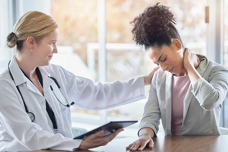 Woman at the doctors for radiating pain